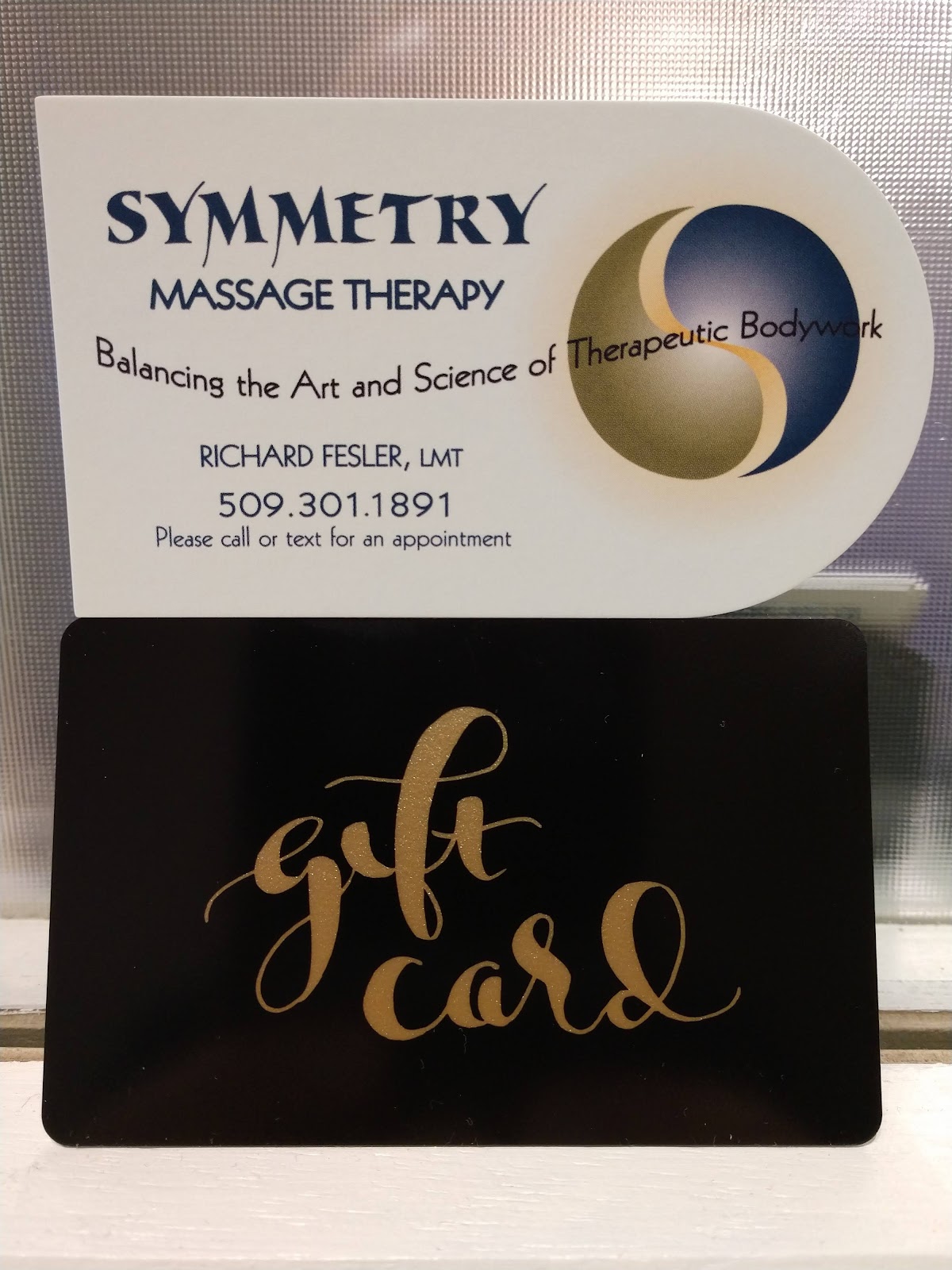 Symmetry Massage Therapy card and gift card